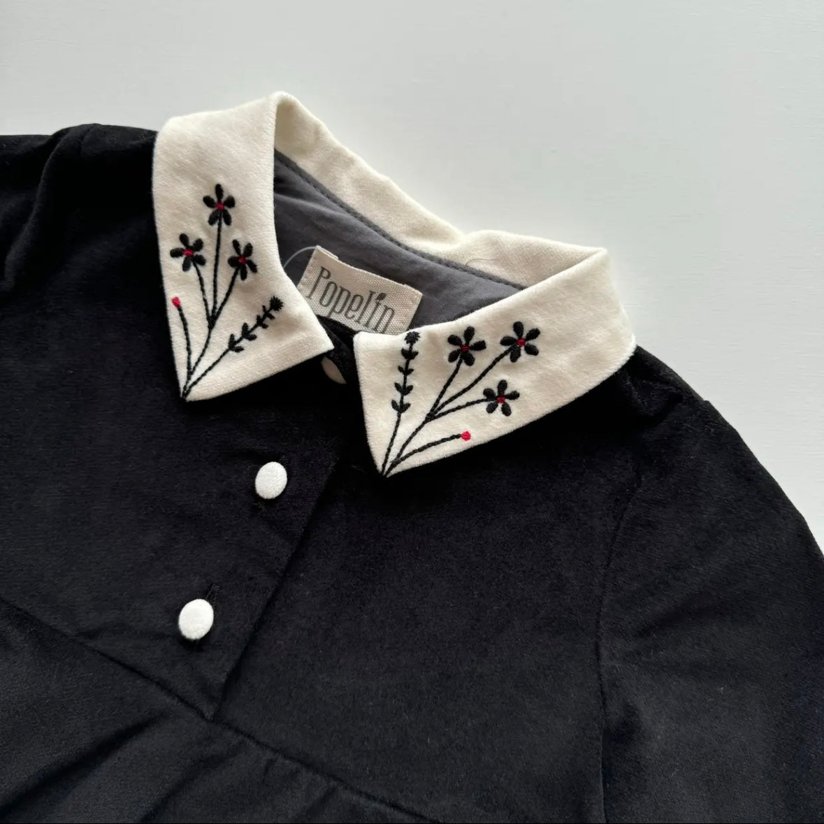 Popelin / Black velvet romper suit with skirt, embroidered collar and placket