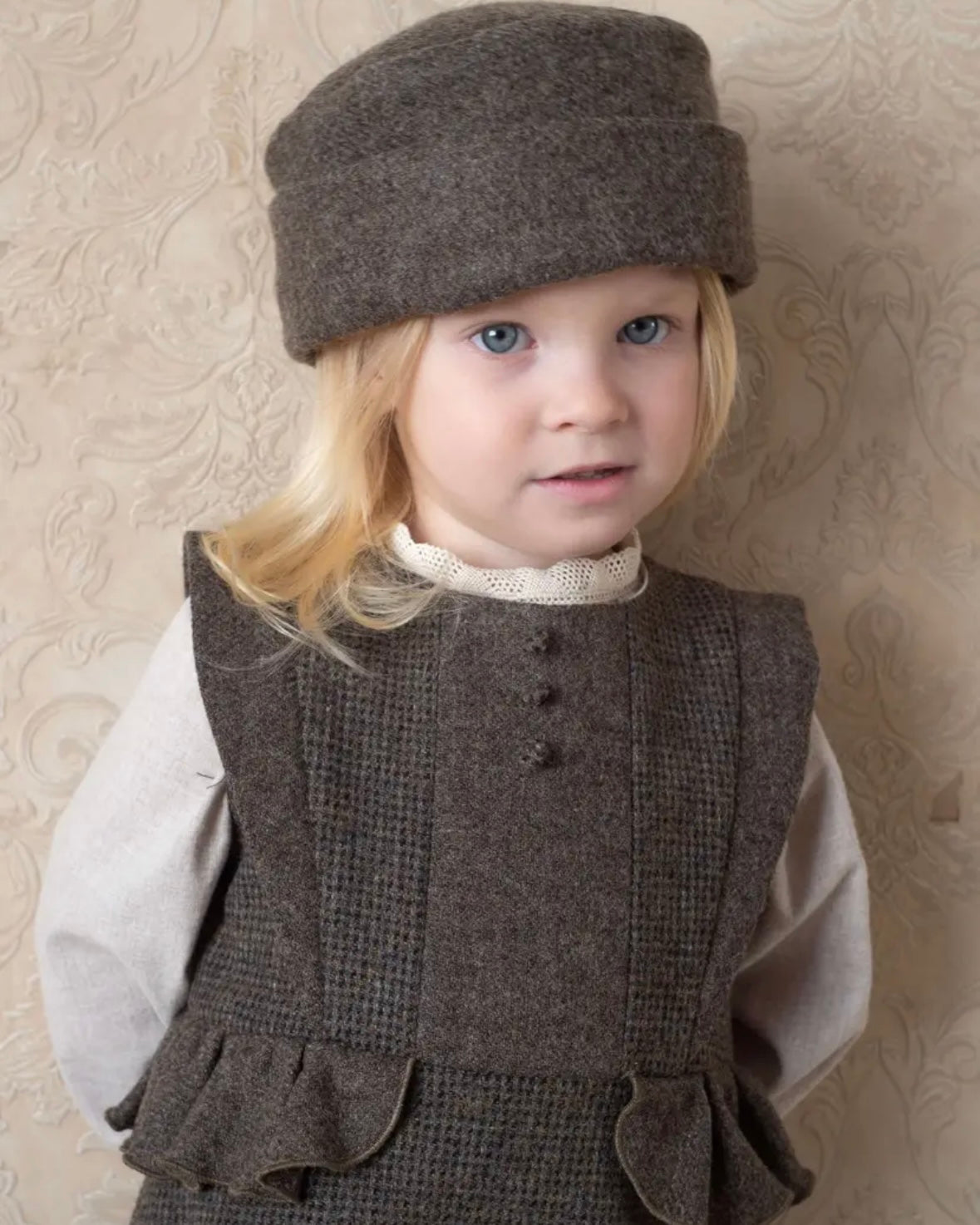 Popelin / Multi-coloured woollen romper suit with frill
