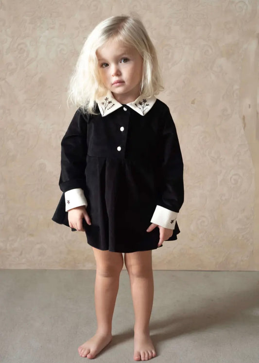 Popelin /  Black velvet romper suit with skirt, embroidered collar and placket